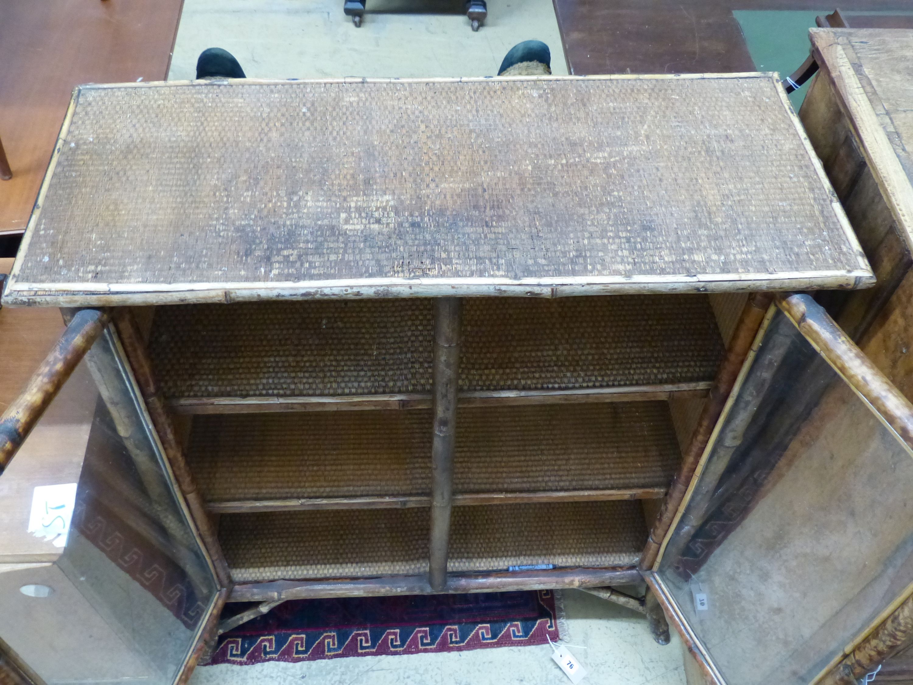 An Edwardian bamboo and cane bookcase, width 91cm